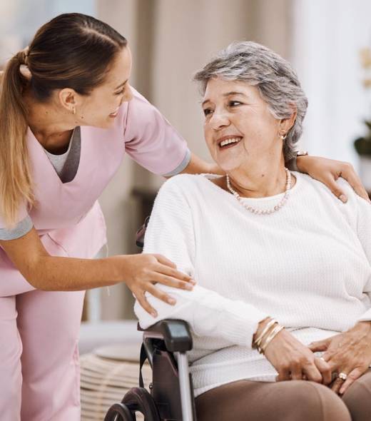 Healthcare, support and caregiver with senior woman for medical help, elderly care and consulting patient. Wheelchair disability, rehabilitation and nurse volunteer at nursing home for charity work.